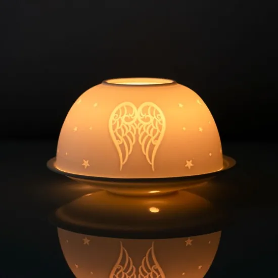 Telys holder englevinge og stjerner skaper en god stemning i rommet. www.engleshop.no